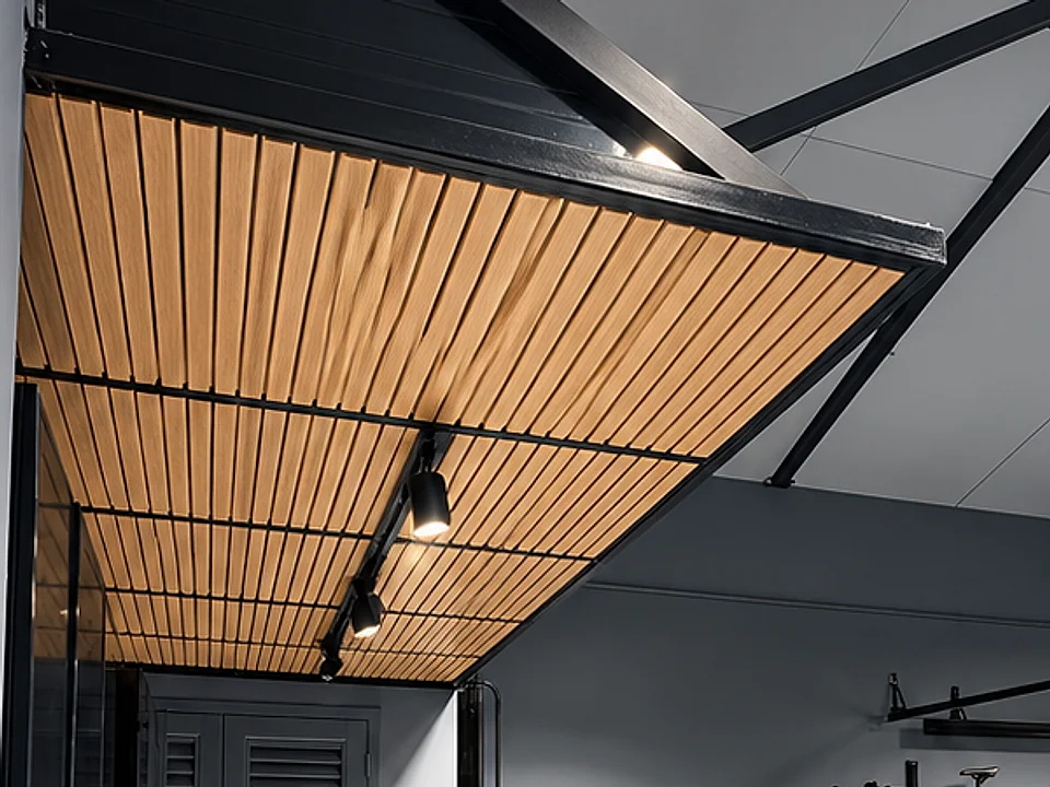 Underside of the overhead storage platform built at Villa G28: black steel frame, timber-slat soffit and integrated spotlights
